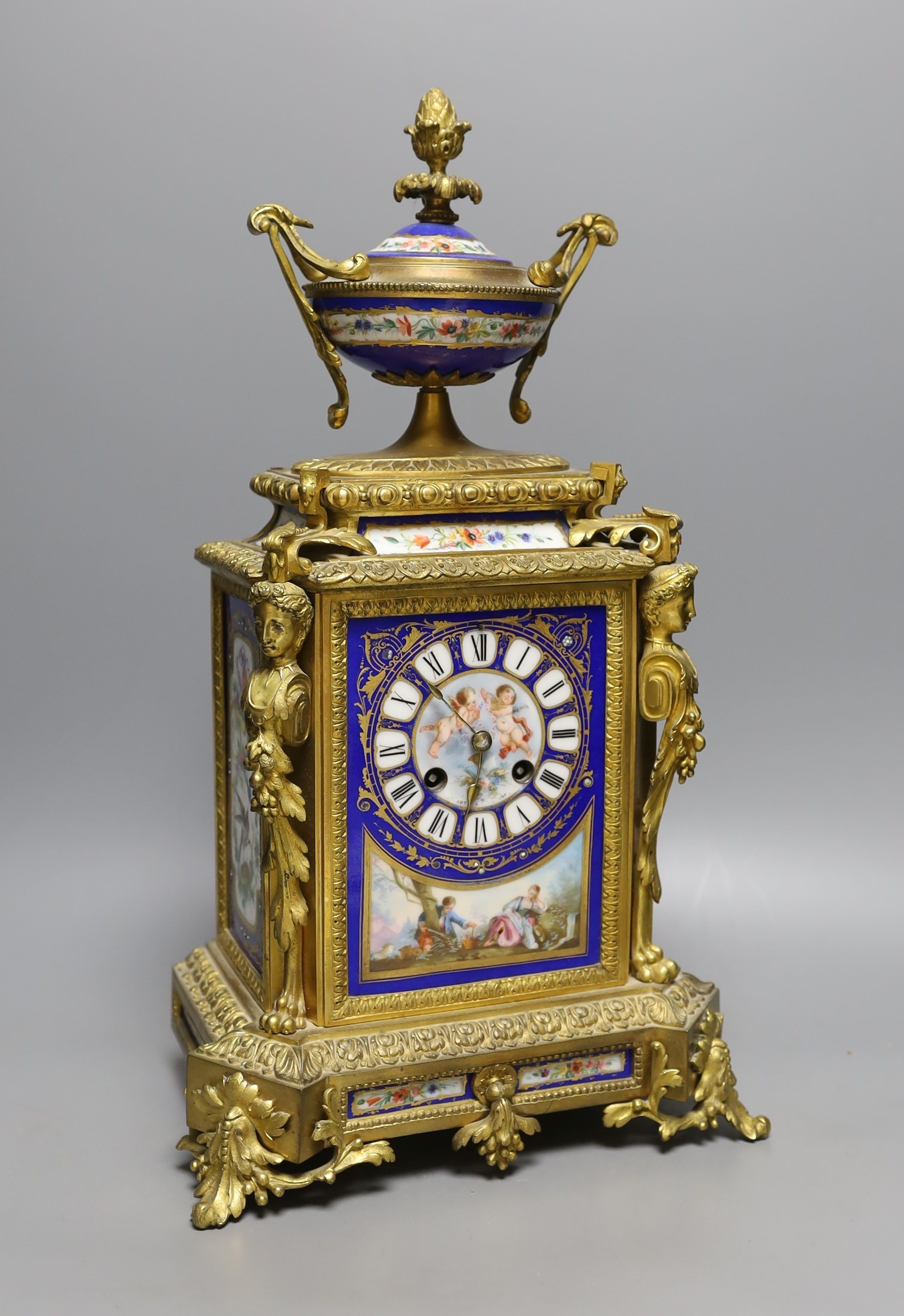 A late 19th century Sevres style porcelain and ormolu mounted mantel clock 42cm